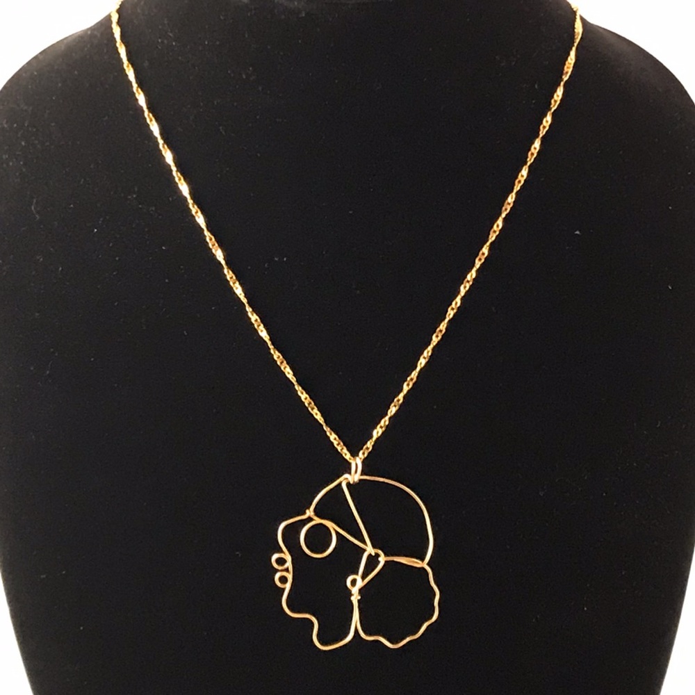 Gold chain with lady pendant